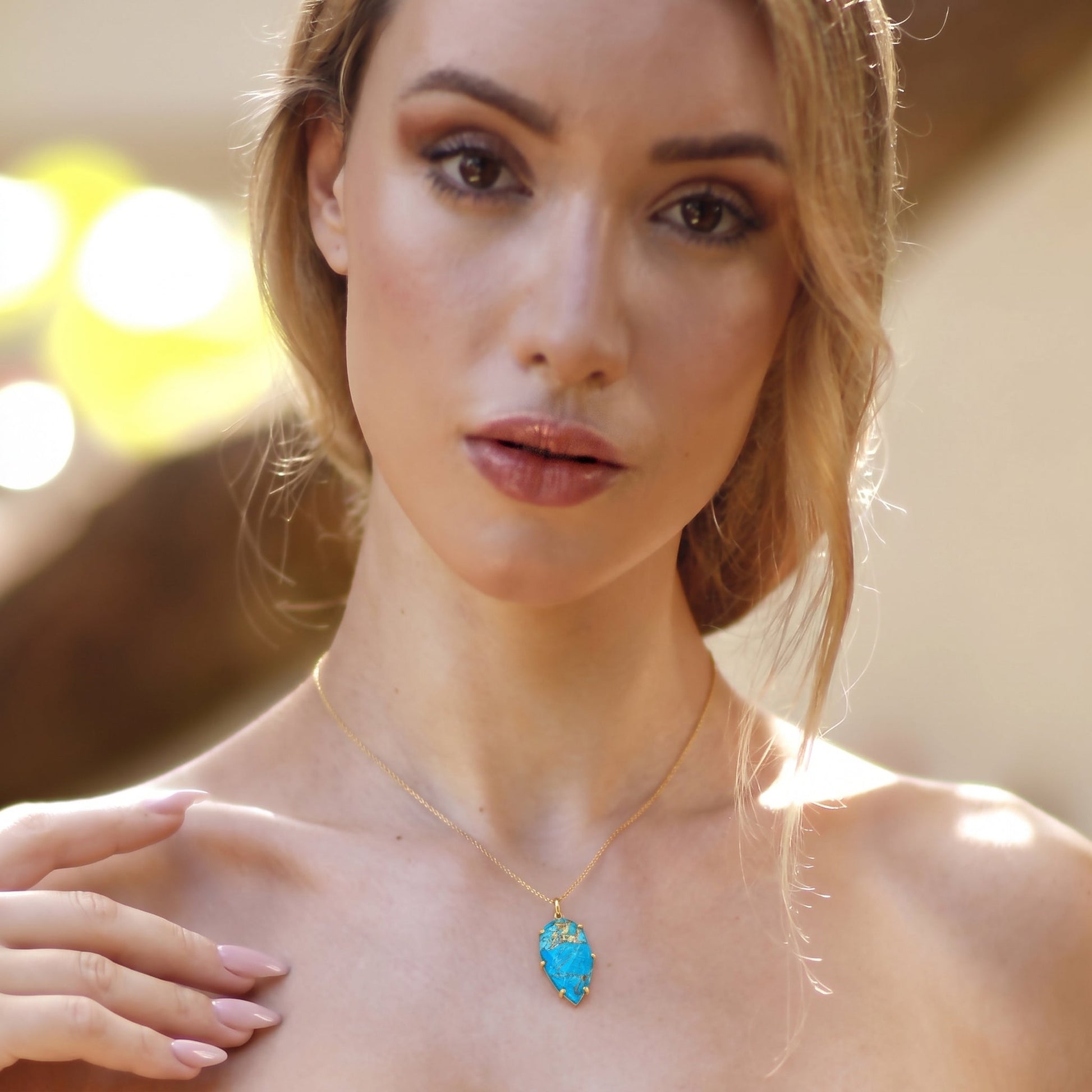 Turquoise gemstone pendant necklace close-up