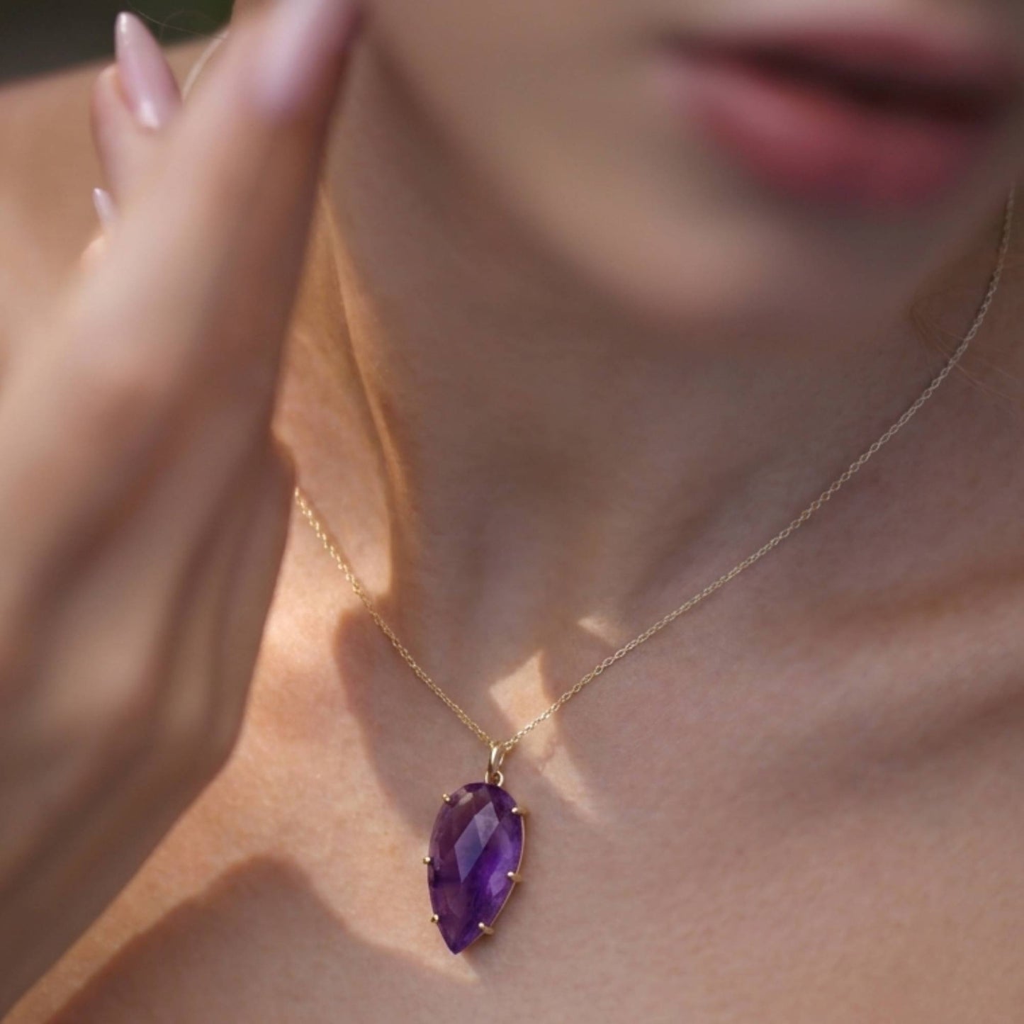 Amethyst gemstone pendant necklace detail